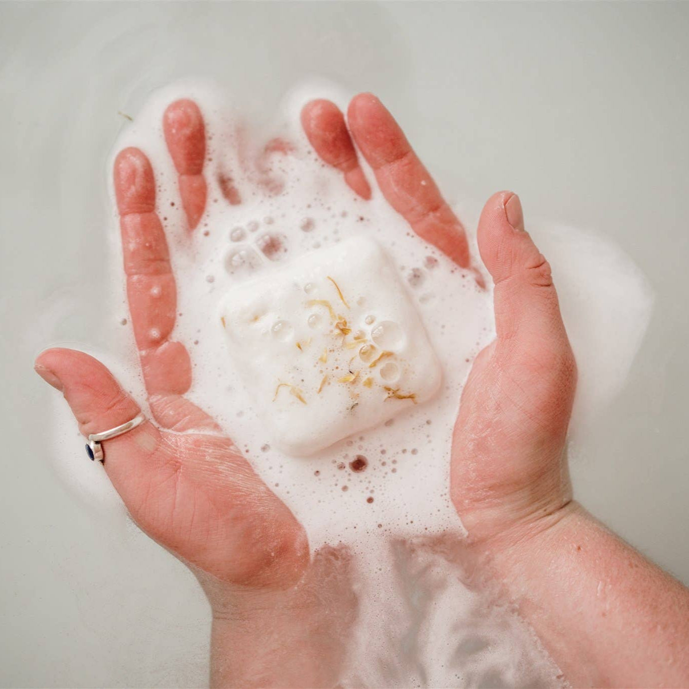 Hands holding bath bomb