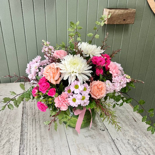 Pink and white flowers in large vase