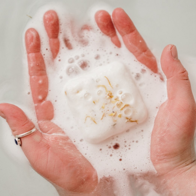 Hands holding bath bomb