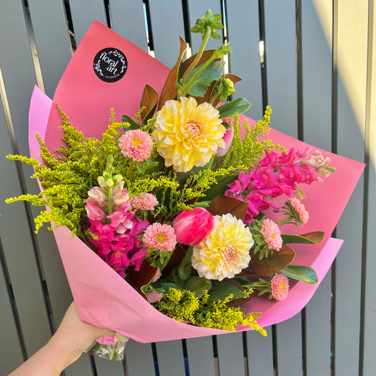 pink orange and yellow flowers in a bouquet