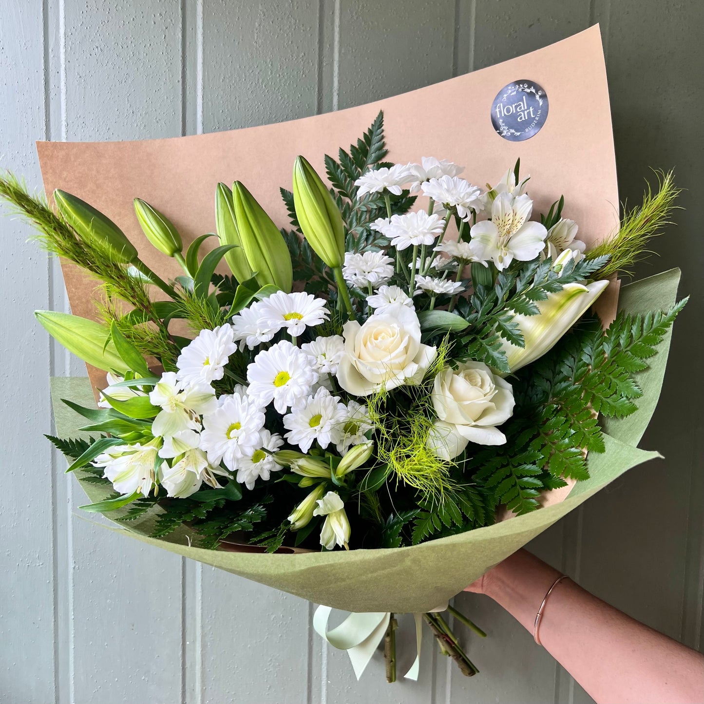 green and white flower sympathy bouquet