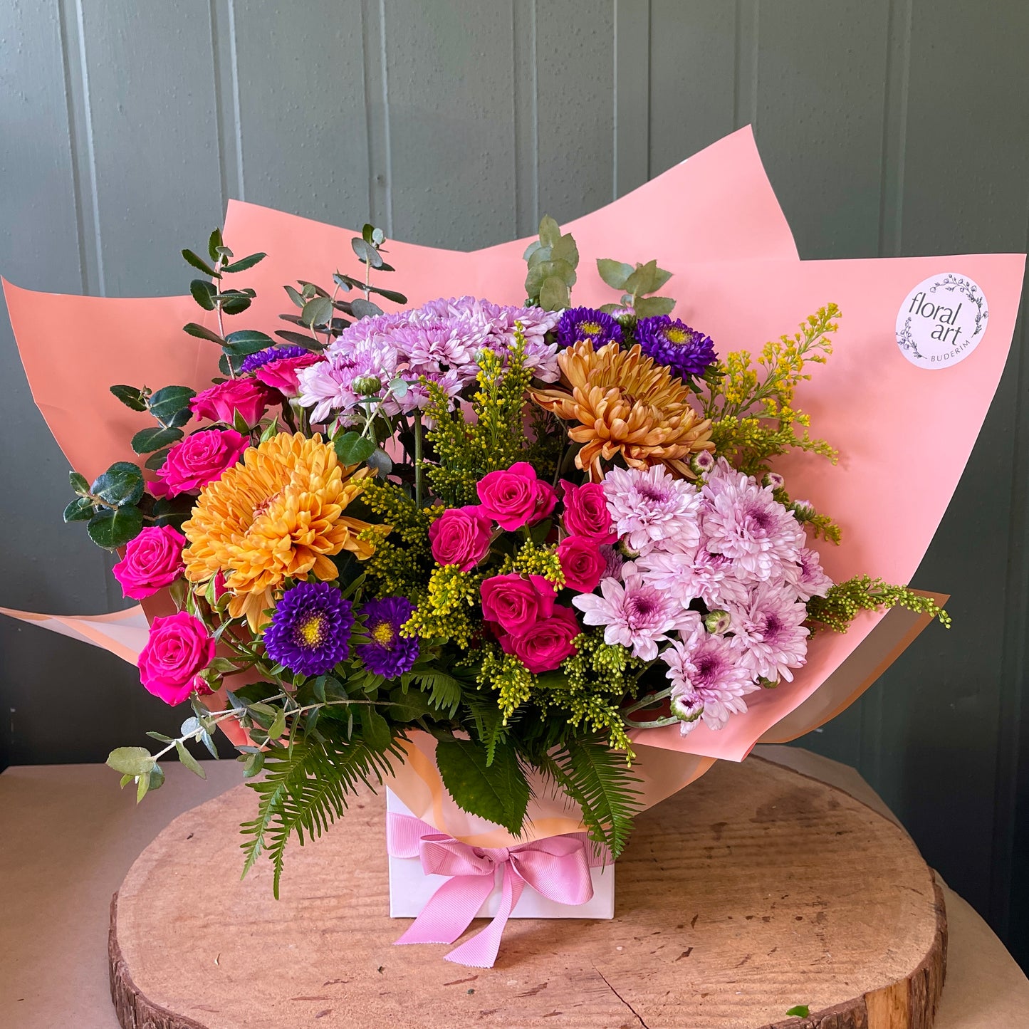 bright flowers arranged in a white box