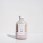 Bottle of 'Butt Naked' rose mask on a white background