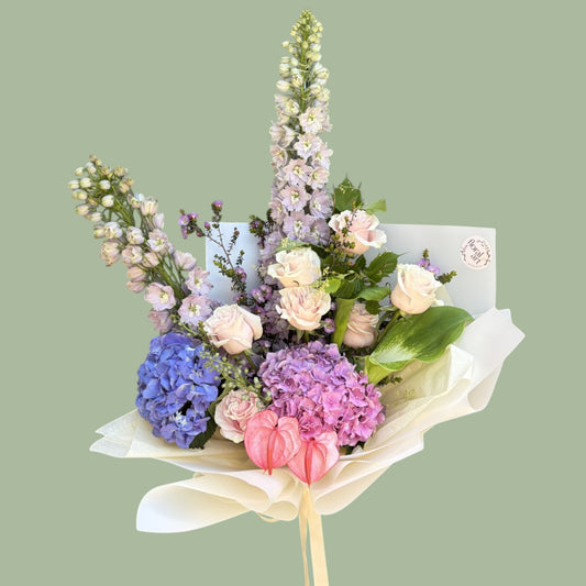 Bouquet of flowers on a light green background