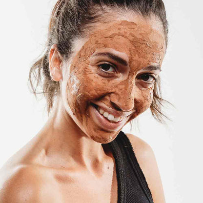 Woman with a brown face mask on a white background