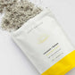Butt Naked Coconut and Lemon body scrub on white background