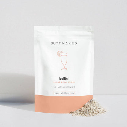 Butt Naked bellini sugar body scrub packaging on a light gray background