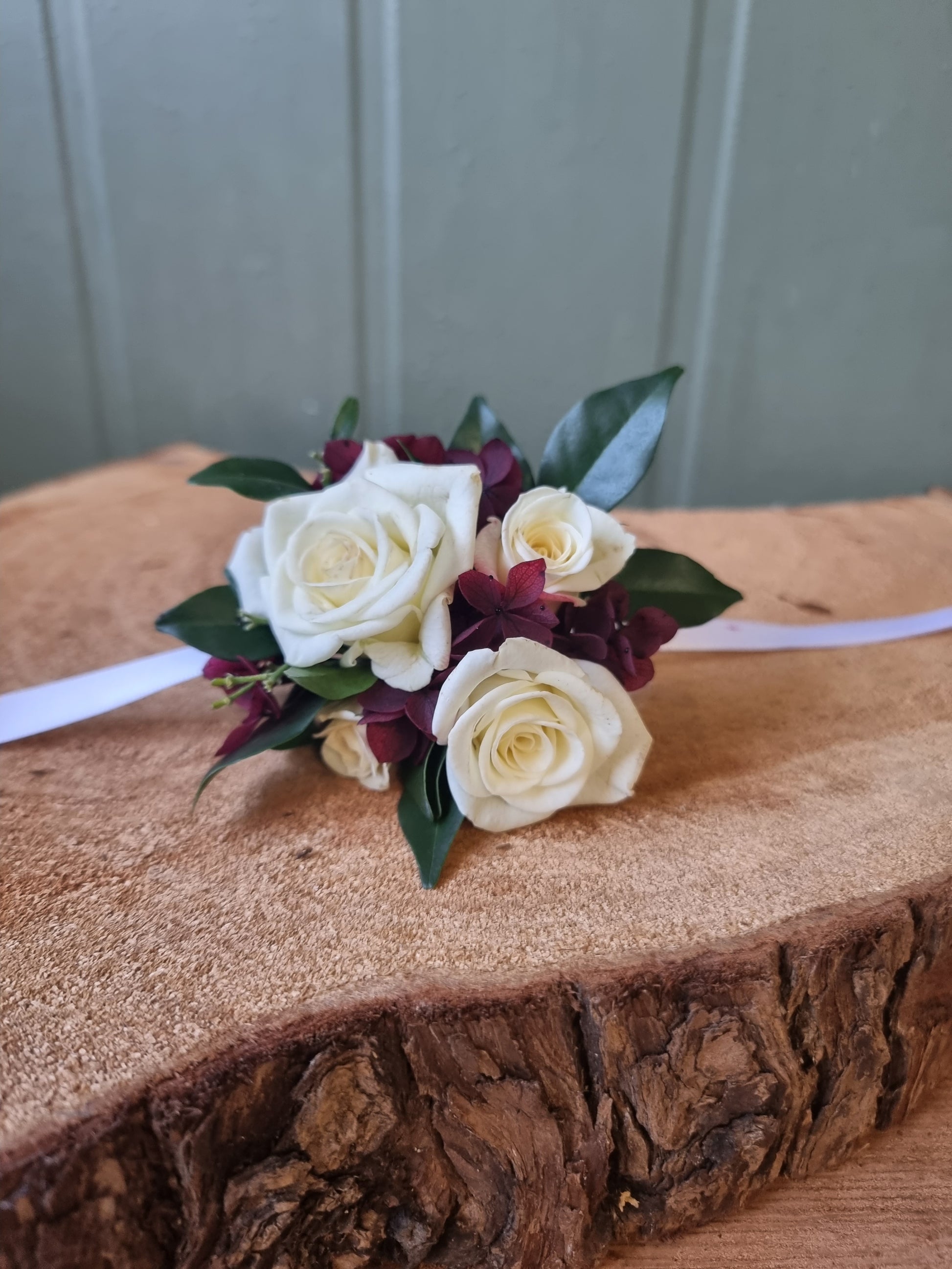 Wrist corsage burgundy and white