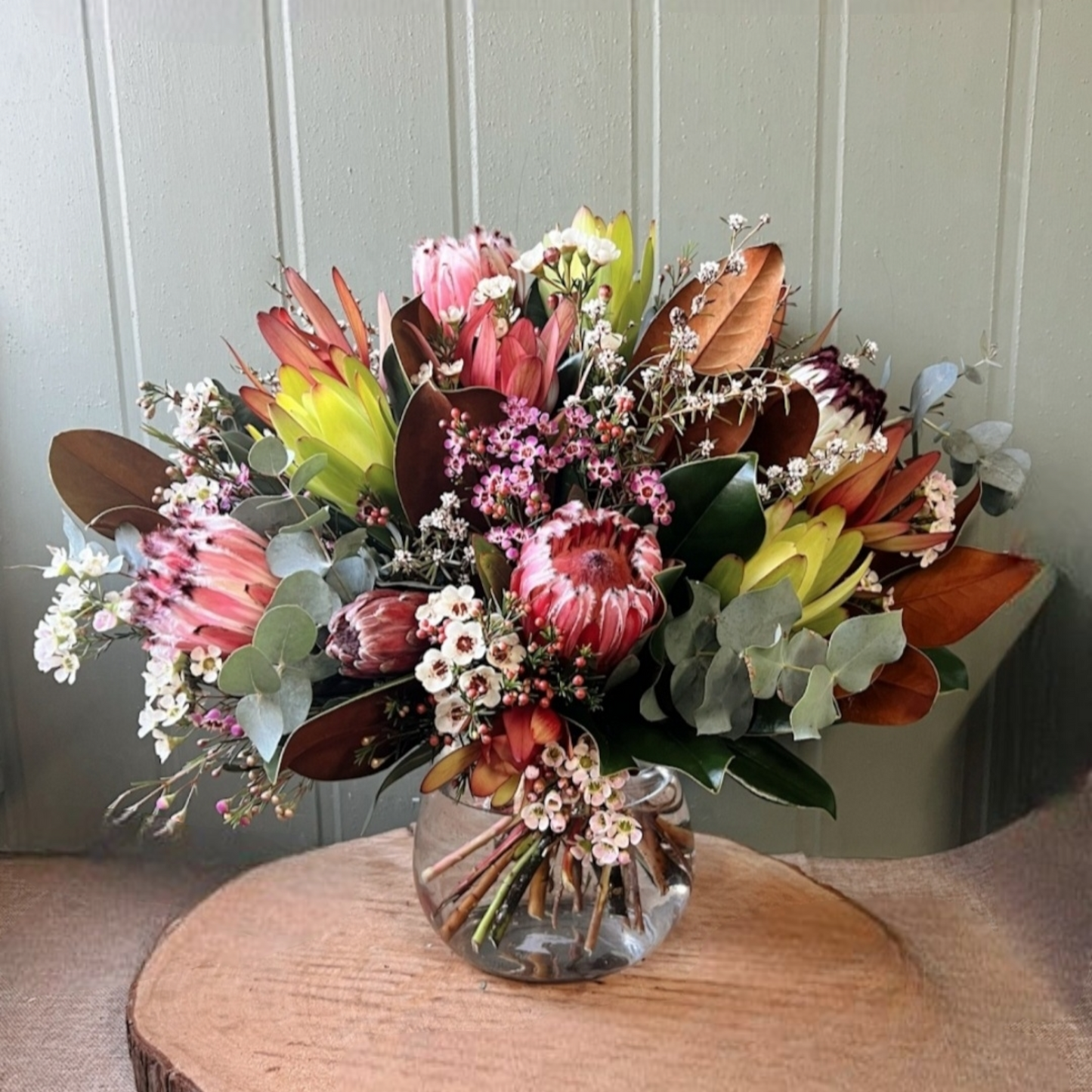 Seasonal mix of Australian native and wild flowers arranged in a vase