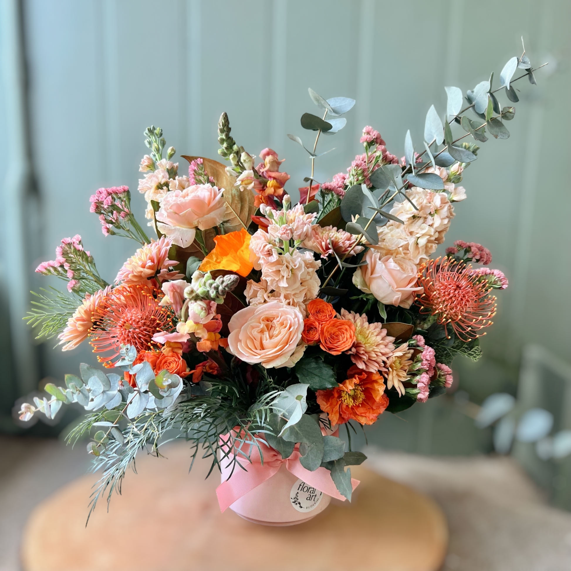 mixed peach flowers in a pot