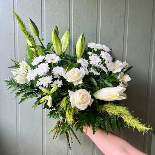 Green and white flowers in bouquet 