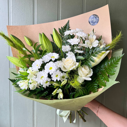 green and white flower sympathy bouquet 