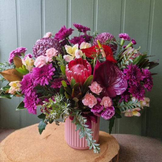 Burgundy and bold flowers in vase